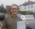 Dominik with Driving test pass certificate